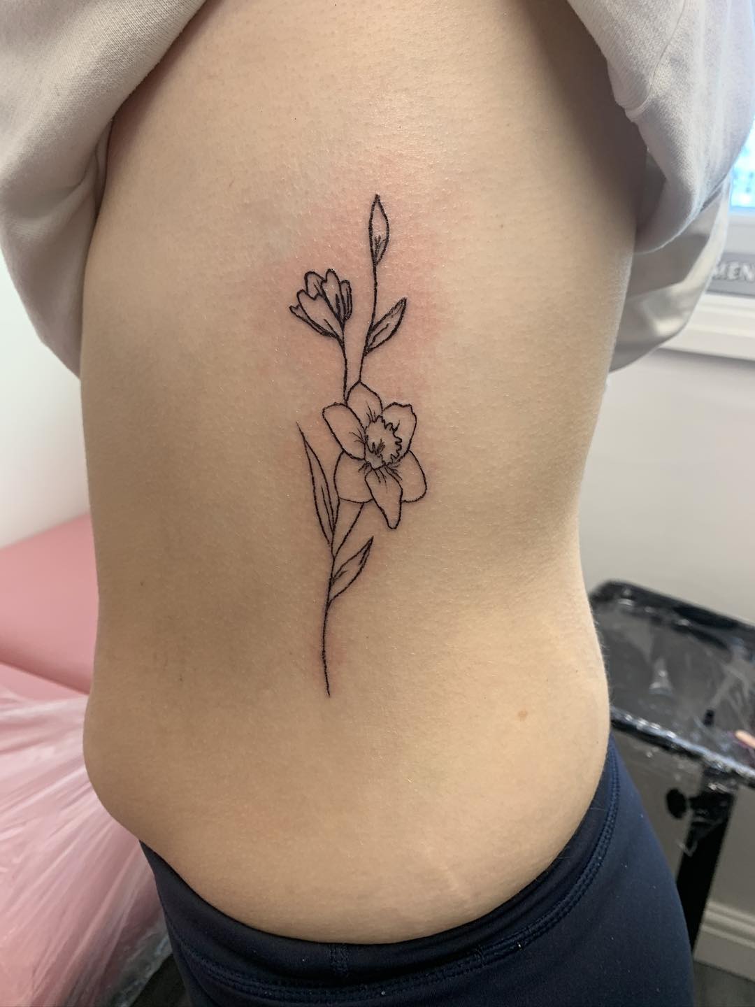 Tiny fine line symbol tattoo by Ink By LOLO Ainsdale Southport